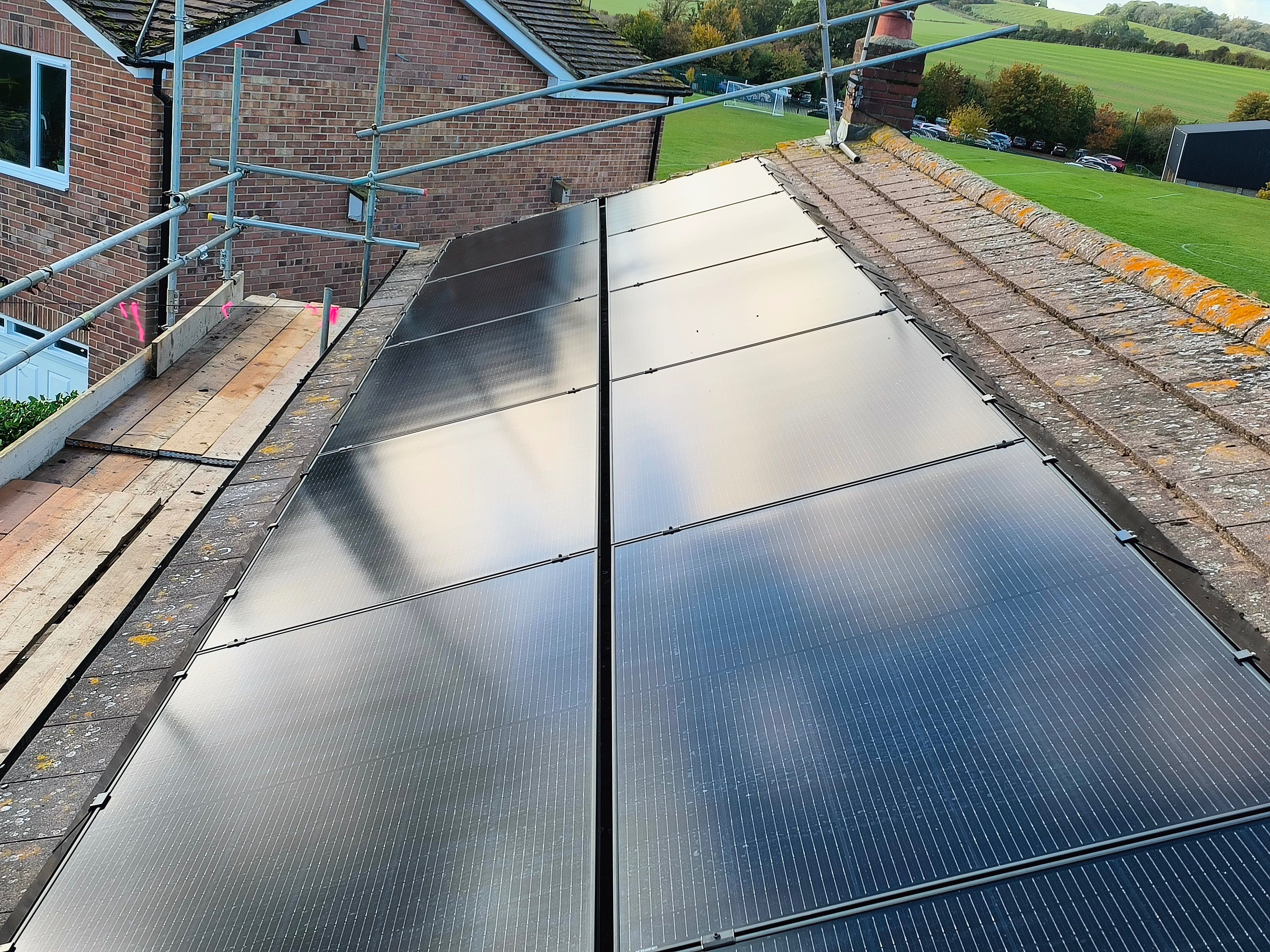 Solar panel array installation with countryside views